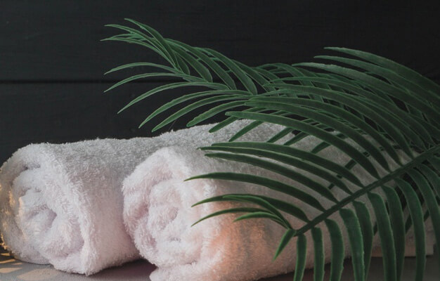 massage room towel and plants