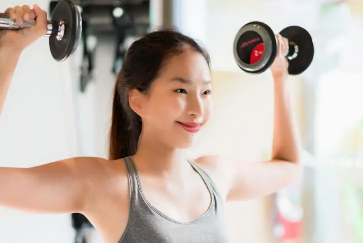 asian number in gym with tight grip