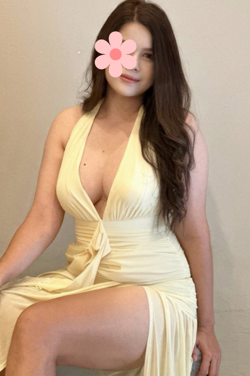 a glamorous and curvy thai woman in a revealing dress