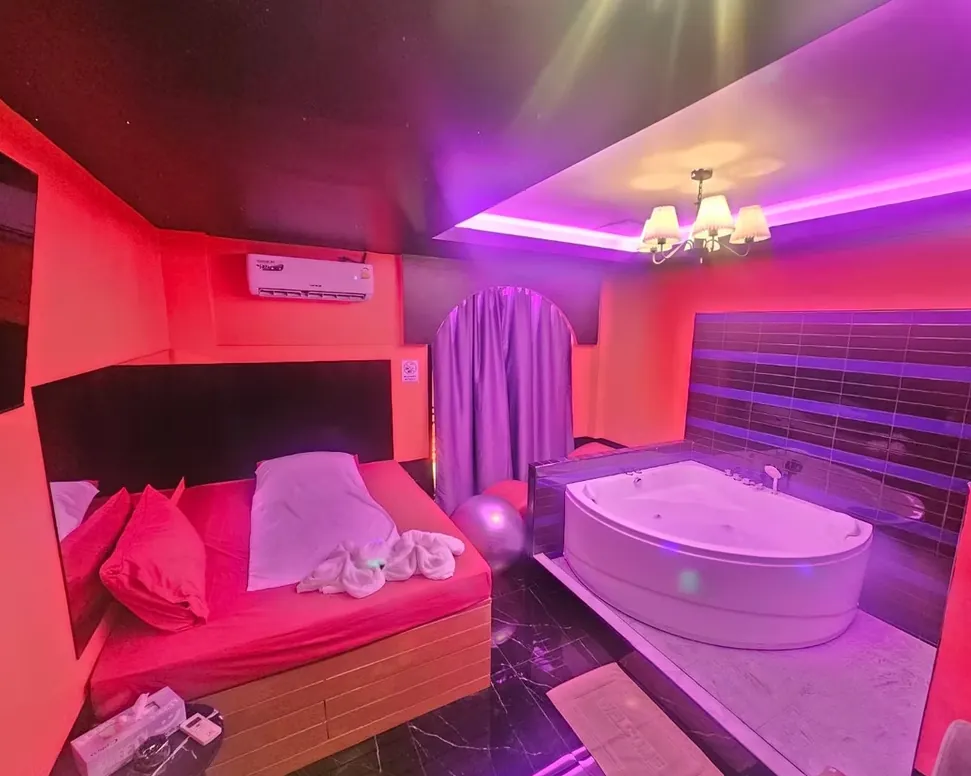 room built for nuru massage with tub and mat and mirror on the wall