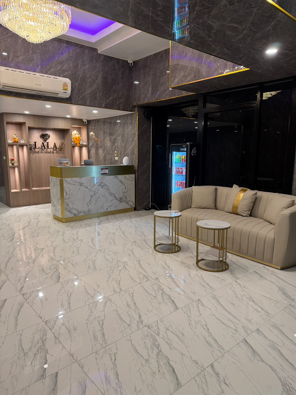 lobby at massage parlor with white marble floors and walls